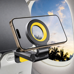 MagMore MagSafe telefoonhouder met smartphone bevestigd aan vliegtuigtafeltje